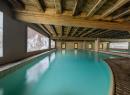 Indoor  swimming pool and outdoor heated pool at Spa La Beauté du Blanc