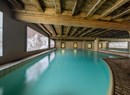 Indoor  swimming pool and outdoor heated pool at Spa La Beauté du Blanc