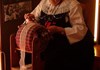 Craftswoman in typical Cogne dress