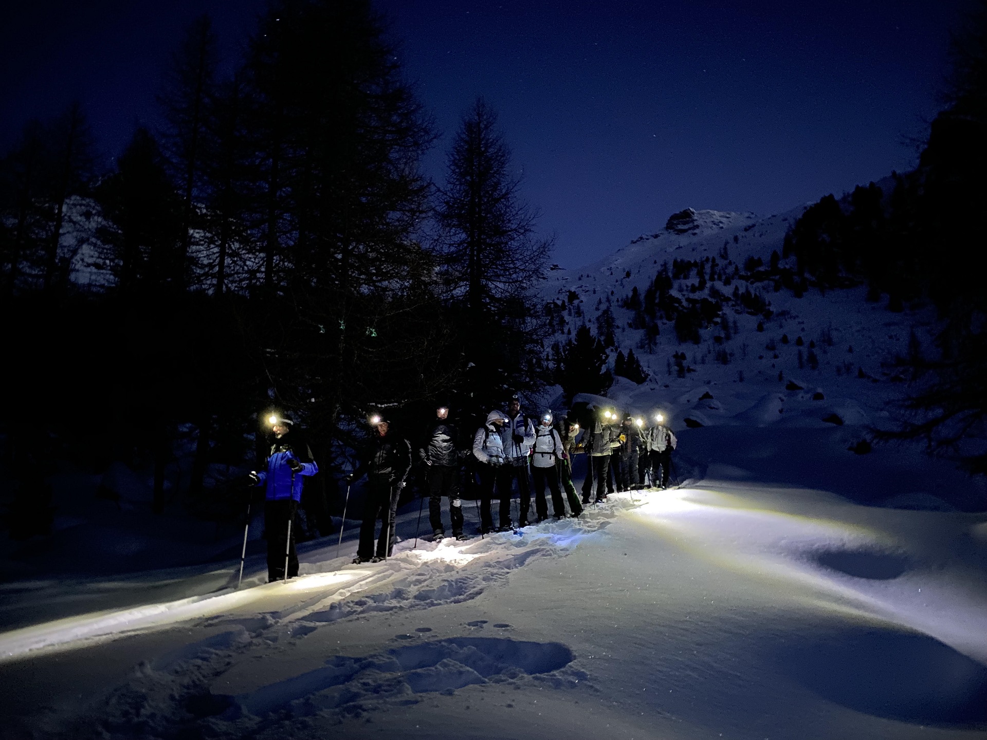 Snowshoeing at sunset in Val d'Ayas