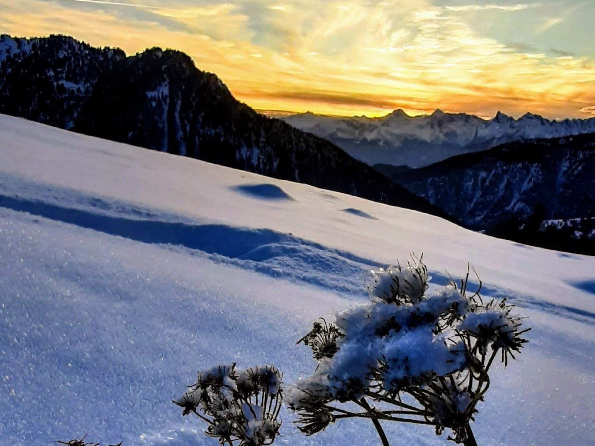 Snowshoeing at sunset in Val d'Ayas